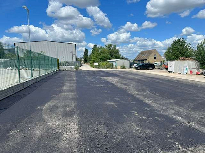 machine lay temporary car park using ac20 basecourse level and compact using machine pavior