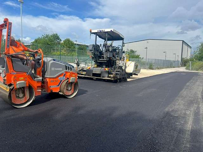 machine lay temporary car park using ac20 basecourse level and compact using machine pavior